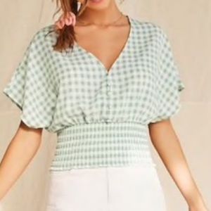 Green and White checkered blouse.